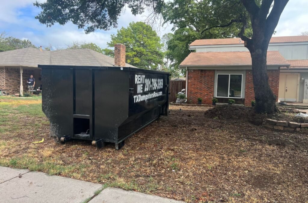 TX Dumpsters R Us employee delivering a construction dumpster in Lancaster, TX.