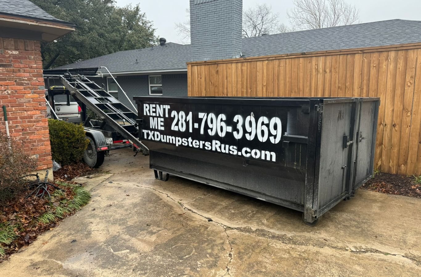 A TX Dumpsters R Us professional managing a dumpster rental in Duncanville, TX, highlighting our commitment to affordable and flexible service. Dumpster Rental Near Me.